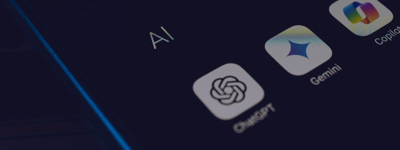Image of phone screen showing icons for ChatGPT, Gemini and Copilot AI applications representing the tools used for SEO in 2025 - Screen is black and has a slight blur to help with text readability