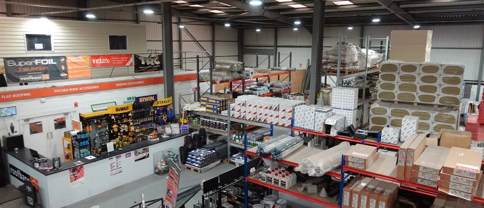 Roofing materials and stocked shelving inside Roofbase Cardiff.