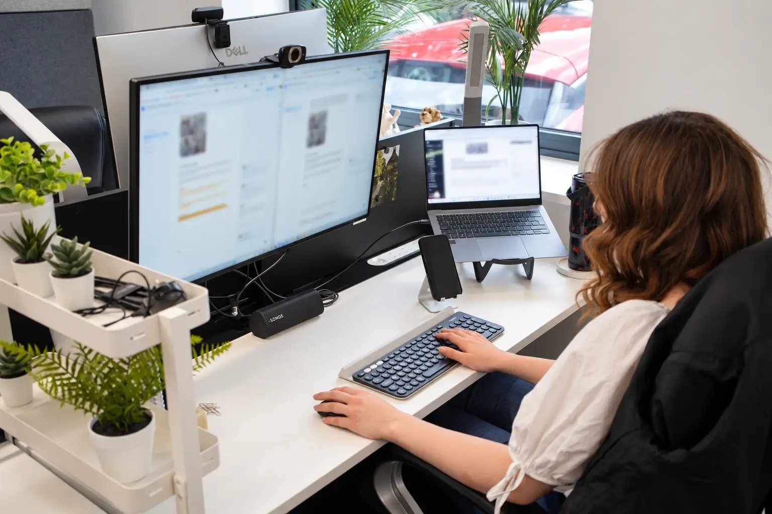 Mia Deeming working on content and copy at her desk.