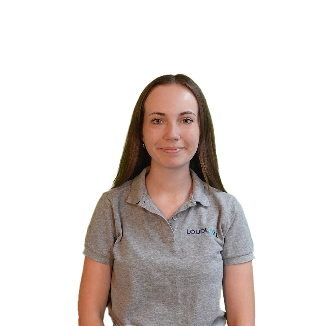 Amelia Perkins wearing a grey loudlocal poloshirt and smiling